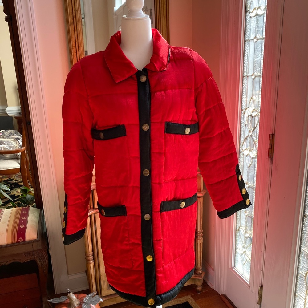 Vintage red puffer coat with black trim. Size Medium